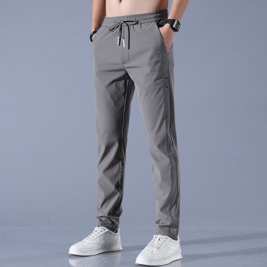 Grijze herenbroek, lente-zomer casual stijl, ademend en slank ontwerp, met elastische tailleband en trekkoord, geschikt voor sport en vrije tijd.